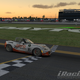 The Team Oppo Miata passes under the checkered flag as the sun begins to set and 2.4 hours passed since the green.